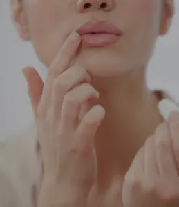 woman touching her lip