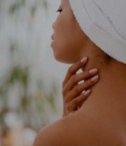 close up of a woman's chin and neck from behind