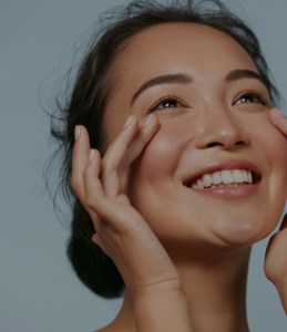 woman touching her face